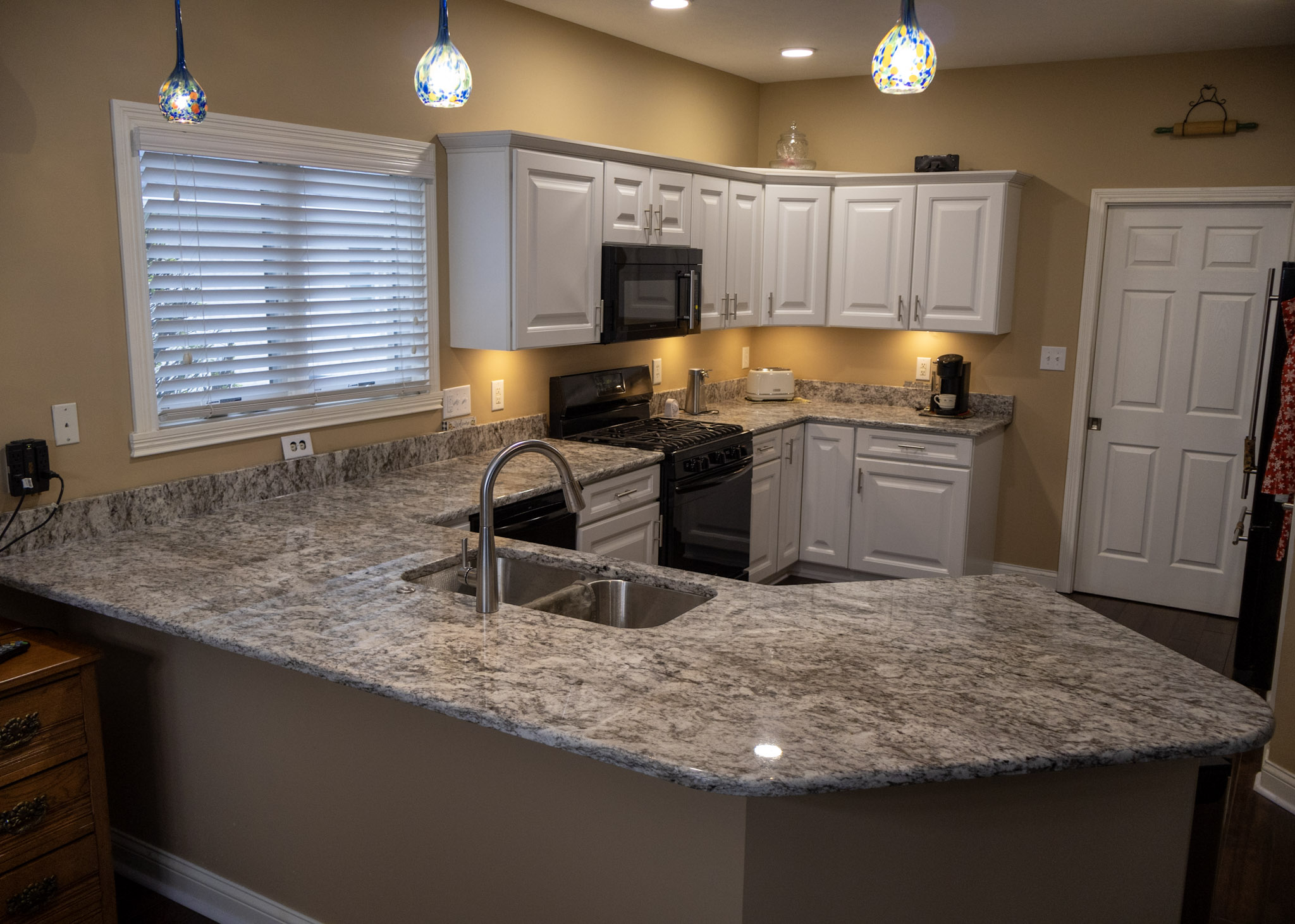 Kitchen remodel with new granite countertops with a new bathroom vanity top as well.