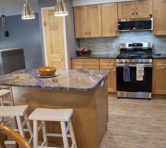 American Soapstone Granite On Perimeter Tops; Blue Bahia Granite On Island Kitchen Remodel by Olympia Stone project photo