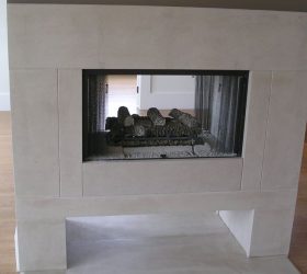 white sleek stone fireplace