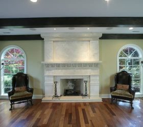 stone fireplace with chairs