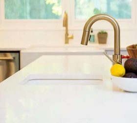 gold faucet in the kitchen